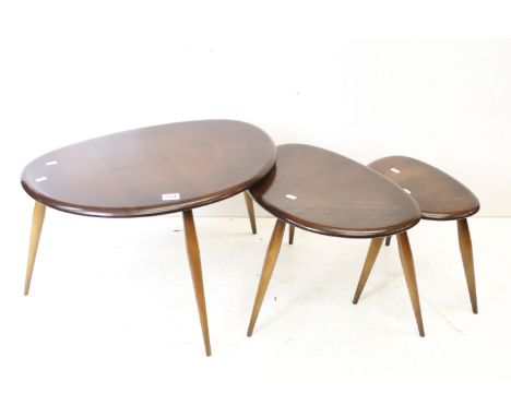 Ercol Nest of Three Dark Elm and Beech Pebble Tables, model no. 354, largest table 41cm high x 65cm wide 