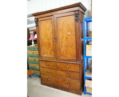 19th century Mahogany Linen Press, the two upper panel doors opening to four pull-out linen slides, the base with two short o