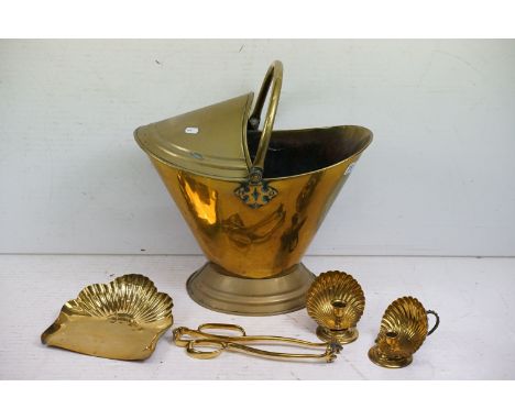 Brass coal scuttle of helmet form, with loop handle (approx 40cm high - excluding handle), together with a pair of brass cand