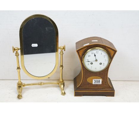 Early 20th C mahogany mantel clock of concave form, with boxwood stringing and shell inlay, with a French movement, approx 24