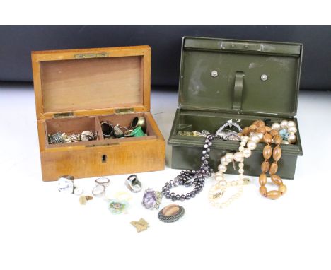 A collection of mainly vintage costume jewellery contained within two boxes to include rings, cufflinks, brooches, necklaces.