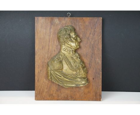 19th Century Duke of Wellington gilt metal profile, mounted on a rosewood panel. Measures approx 25.5cm x 20.5cm 