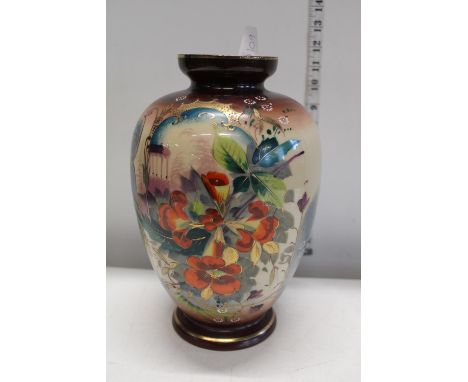 A vintage hand painted glass vase 