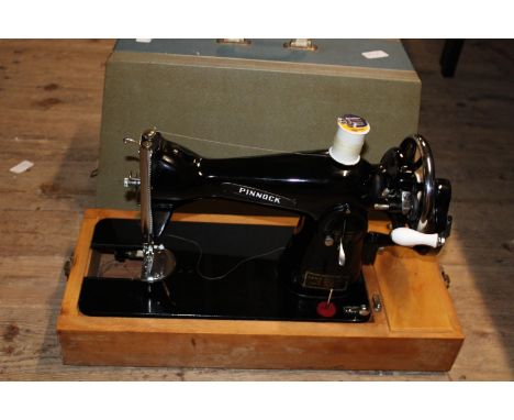 A vintage Pinnock sewing machine, postage unavailable 