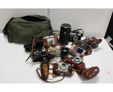 A job lot of assorted vintage cameras and accessories 