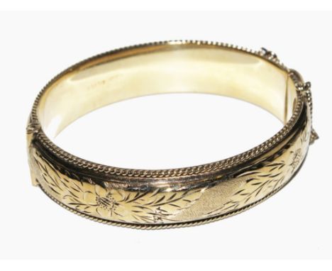 A gold washed silver bangle, 33g