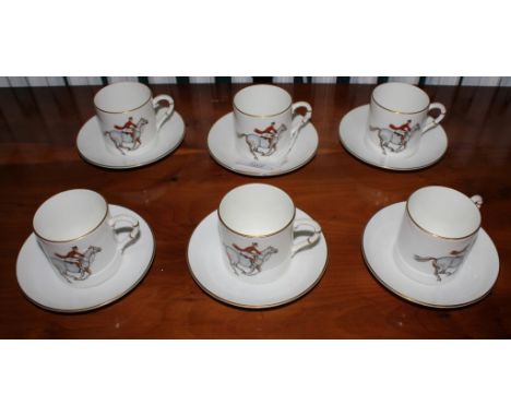 A set of six Royal Worcester coffee cups and saucers with equine theme and gold rims