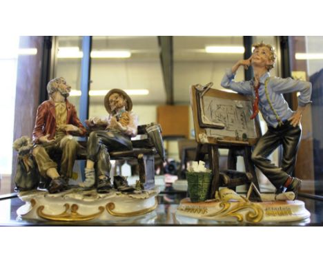 Two Capodimonte figurines, one entitled 'The Engineer', 25cm high, together with two gents chatting on a bench, 20cm high (2)
