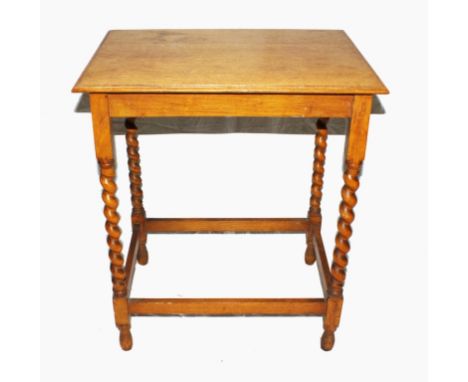 A late 19th century light oak centre or occasional table with shaped top, raised on rope twist legs with stretcher supports, 