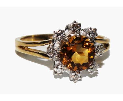 An 18 carat gold diamond and citrine cluster ring