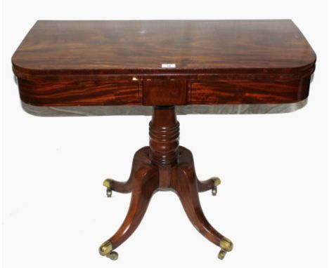 *A Regency mahogany card table with fold over baize top, raised on a turned circular column on a quadruped base with brass to