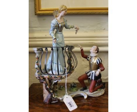 A Capodimonte highly ornate ceramic figurine of Romeo and Juliet scene on a stylized base, 30cm high