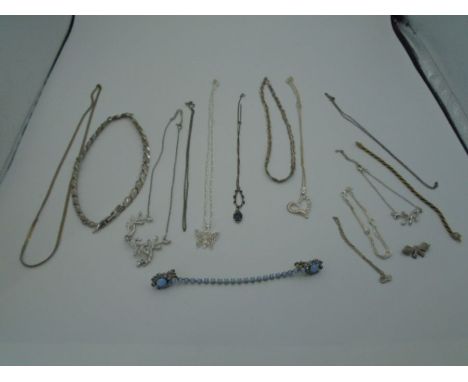 A mixed bag of costume jewellery to include necklaces, bracelets, and a brooch.   