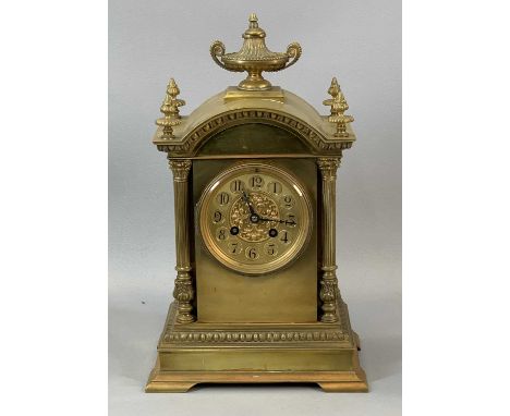 FRENCH GILT BRASS CARRIAGE CLOCK, late 19th century, the arched top surmounted with central urn shaped finial and four corner