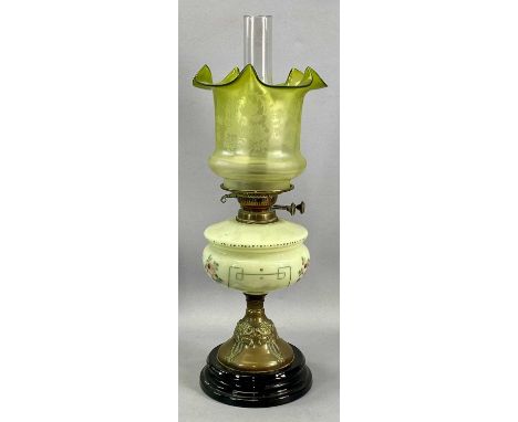 ART NOUVEAU OIL LAMP with floral painted opaque glass reservoir, embossed brass column and black ceramic base, twin burners, 