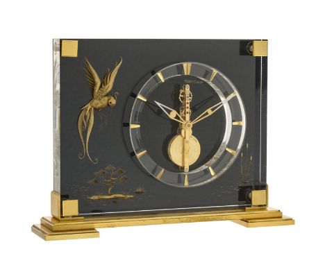 Jaeger-Lecoultre	 Colibri réf. 350	 pendulette en lucite et laiton doré	 circa 1960	 mécanique	 mouvement squelette "baguette