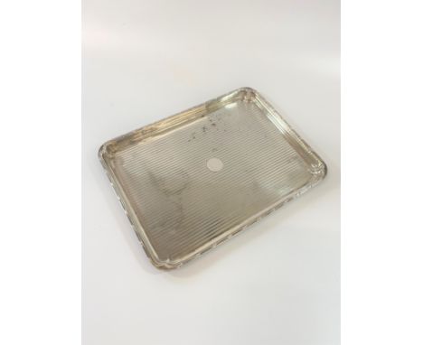 A silver oblong tray with engine decoration - 379gms 