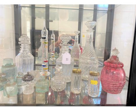 Three glass decanters, phials, thermometer, bottles and cranberry jar and cover 