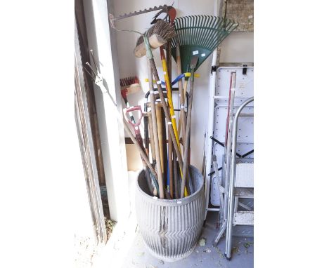 A COLLECTION OF GARDENING TOOLS TO INCLUDE: HOES; RAKES; A FORK; SPADES; A WEEDER