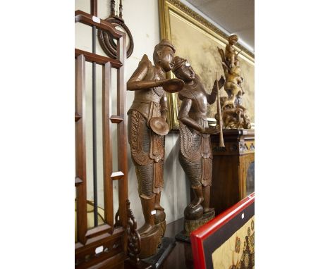 PAIR OF CARVED HARDWOOD FAR EASTERN FIGURES OF MUSICIANS, ONE WITH CYMBALS, THE OTHER A LONG FLUTE, 3'4" HIGH APPROX (2) 