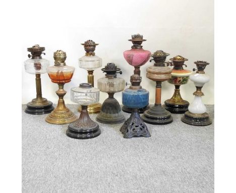 A collection of ten 19th century and early 20th century oil lamp bases, various colours and designs (10)