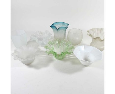 A collection of eight glass lamp shades