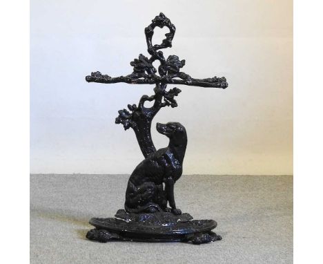 A black painted cast iron stick stand, 70cm high