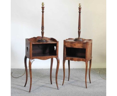 A near pair of French oak pot cupboards, together with a pair of fluted wooden table lamp bases, 59cm high (4)