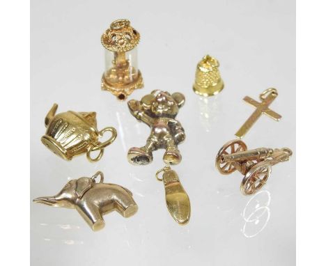A collection of eight various 9 carat gold novelty charms, to include a teapot and a thimble (8)