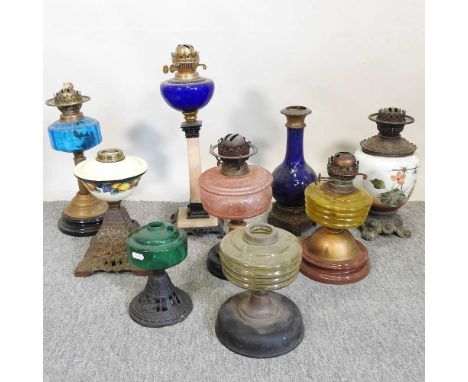 A collection of nine oil lamp bases, various colours and designs (9)