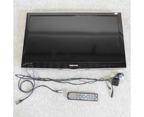 A Samsung flat screen 31 inch television, with remote control and wall bracket