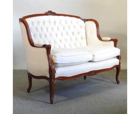 A Victorian cream upholstered show frame style sofa, on cabriole legs130w x 70d x 91h cm