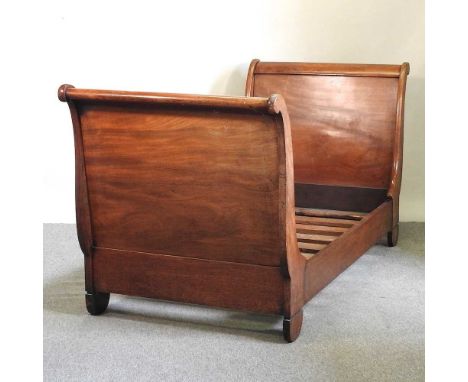 A 19th century French mahogany sleigh bed, with a slatted wooden base100w x 232d x 109h cmOverall this is solid and usable, h