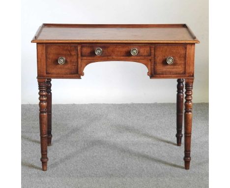 A Regency mahogany washstand, with a gallery back, on ring turned legs91w x 49d x 78h cm
