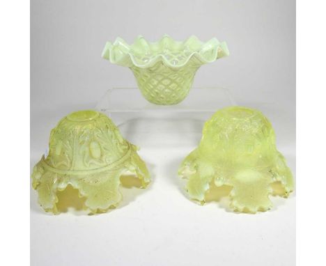 A vaseline glass shade, 17cm dia, together with a pair of yellow pressed glass shades (3)Overall dirty with light wear, vasel