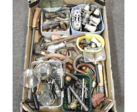A collection of items to include corkscrews, opera glasses, walking stick handles, mother of pearl fruit knives and other ite