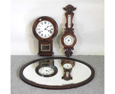 An early 20th century aneroid barometer, together with a wall clock, an oval mirror and two pictures (5)