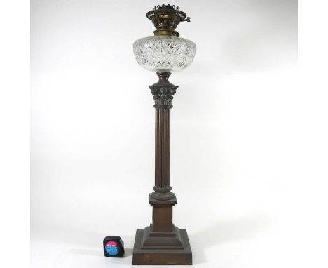A 19th century brass Corinthian column oil lamp, with a glass font, 68cm high overall
