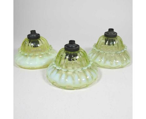 Three Arts and Crafts small vaseline glass lamp shades, circa 1900, each 12cm diameterOverall look to be dirty and worn, one 