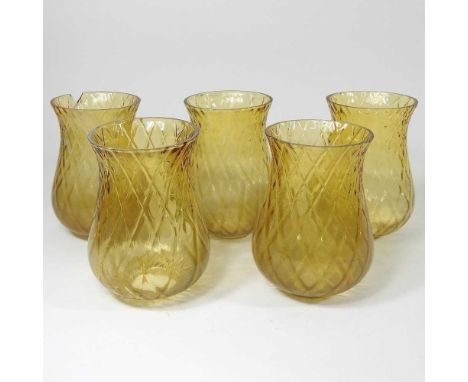 A set of five glass light shades, 15cm high
