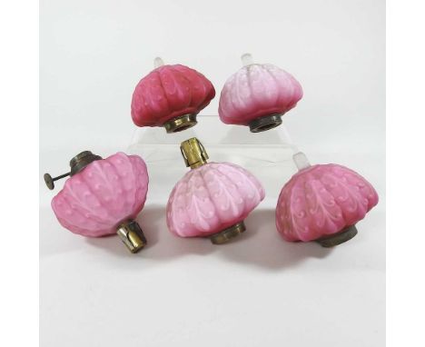 A collection of five pink satin glass peg oil lamp fonts, 10cm dia (5)