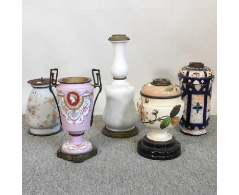 A collection of five oil lamp bases, various designs (5)