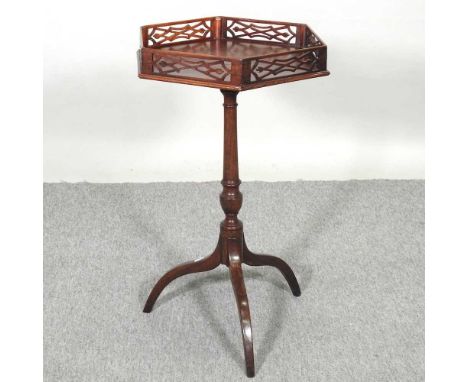 A George III style mahogany occasional table, with a gallery top, on a tripod base39w x 72h cmOverall solid and usable. There