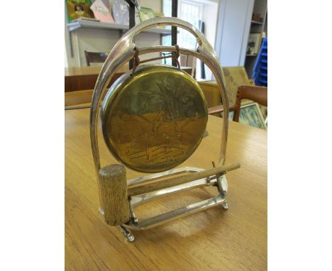 A 19th century Victorian novelty dinner gong in the form of a stirrup with horse hoof feet, riding crop frame stand and an en