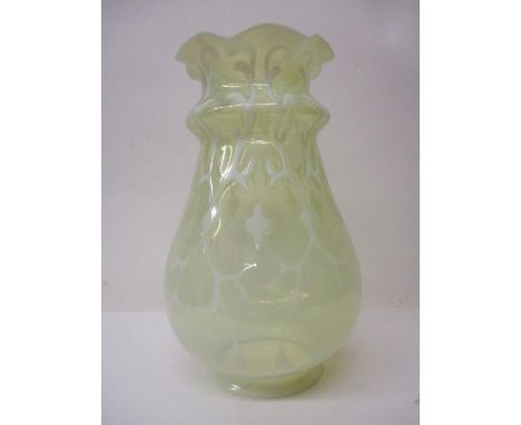 A late 19th century Vaseline glass lamp shade of ovoid form with a wavy rim, 11" h, 4 1/4"dia 