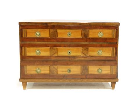 A Continental walnut parquetry commode, 19th century, possibly French, with three drawers, each with fronts veneered with pea