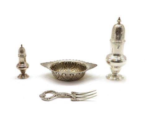 A silver sugar shaker of baluster form, with pierced domed cover, London 1939, together with a similar pepperette, London 197