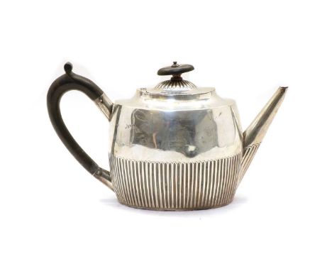 A Victorian silver teapot, London 1888, with partial fluted decoration and engraved crest, 24.5cm wide, 13.1oztCondition repo