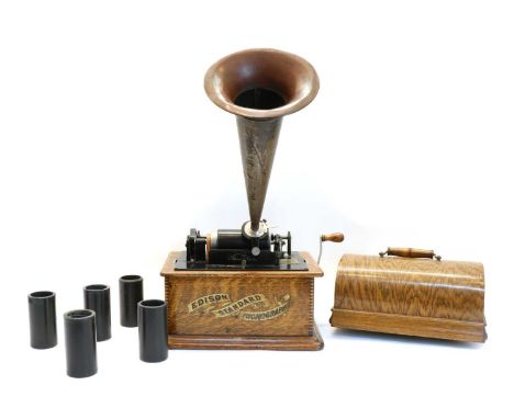 An Edison Standard Phonograph, with oak case and copper and tin horn, together with twelve cylindersCondition report: Horn ha