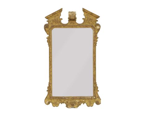 A George II style gilt framed wall mirror,circa 1870, the architectural frame with break-arch pediment, decorated in low reli